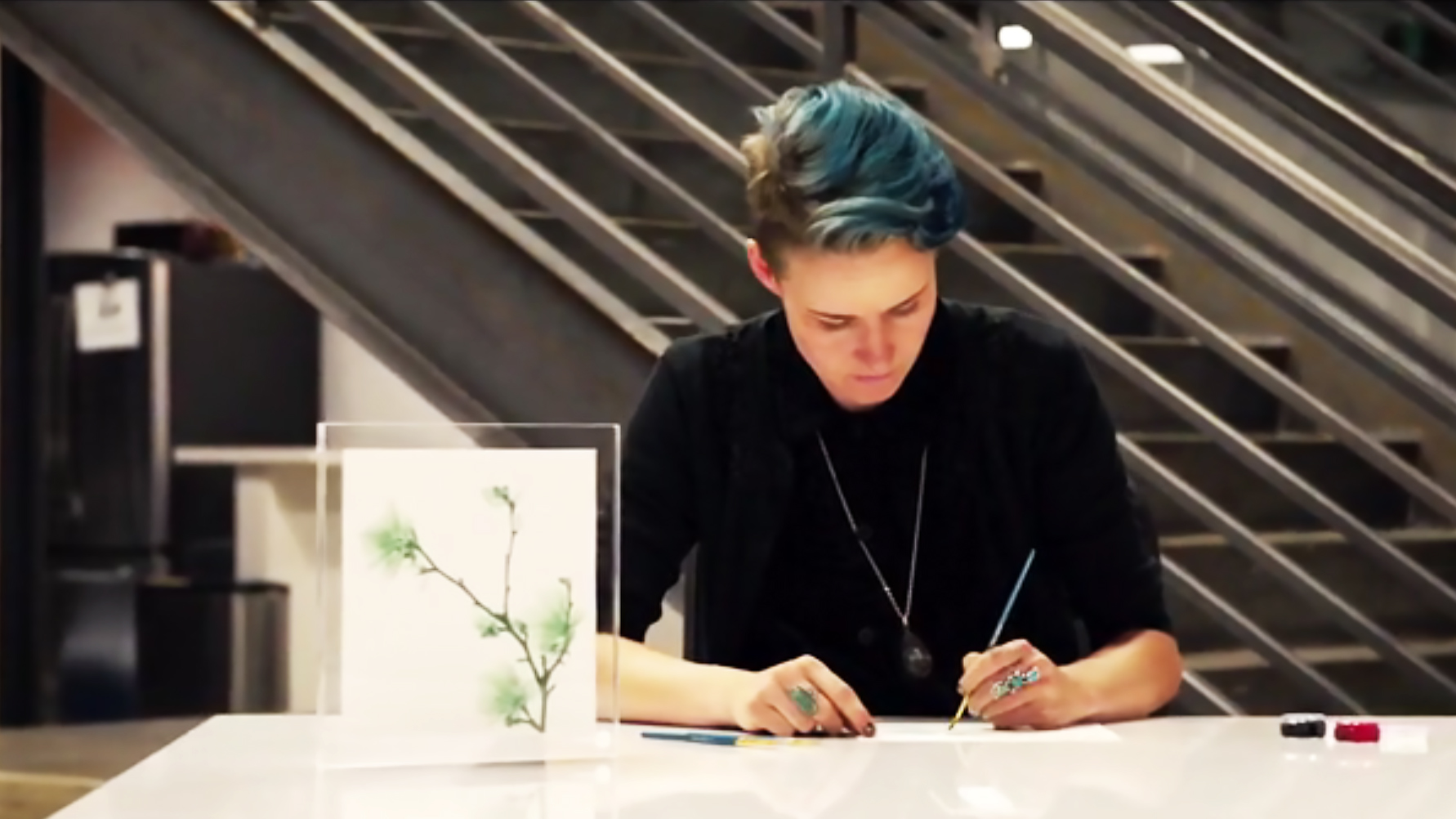 Artist drawing with Living Ink