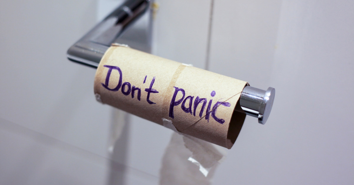 Empty toilet paper roll reading "Don't Panic"