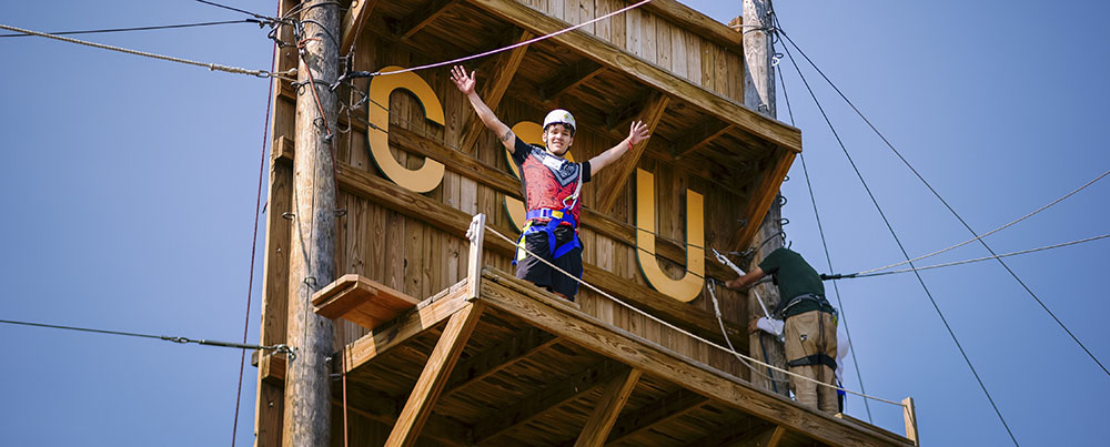 A business summer camp student on the CSU ropes course