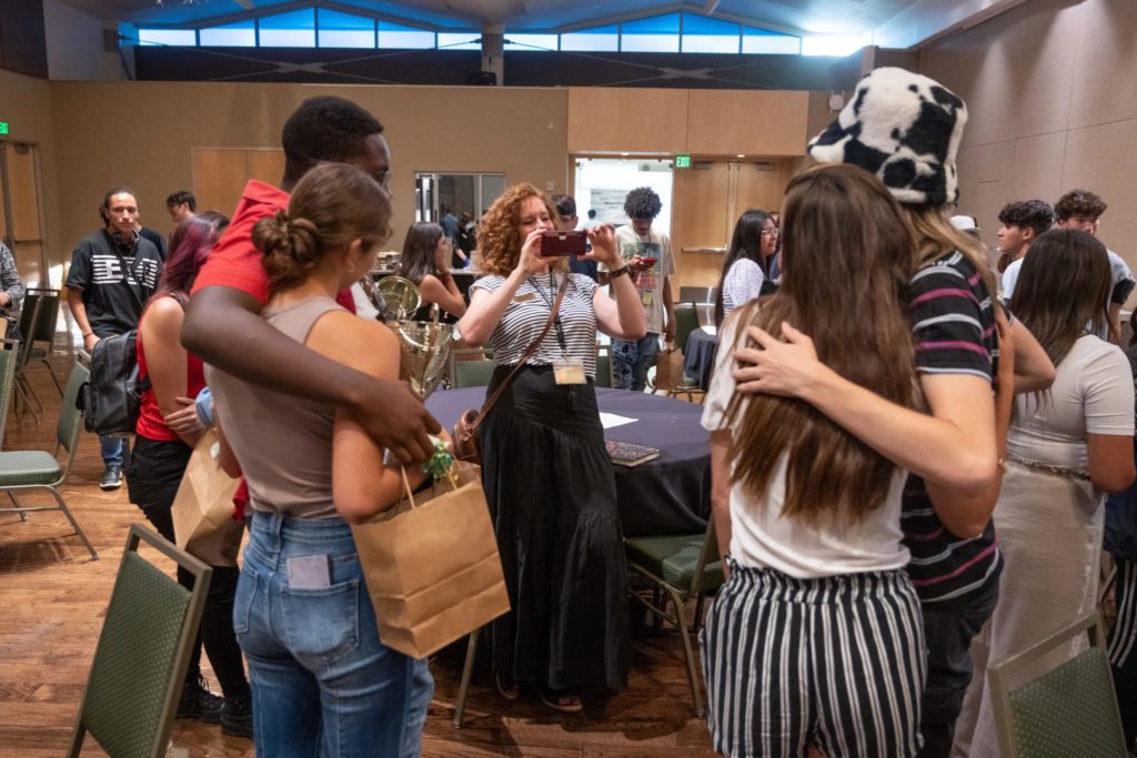 Students hug at First Generation Business Summit
