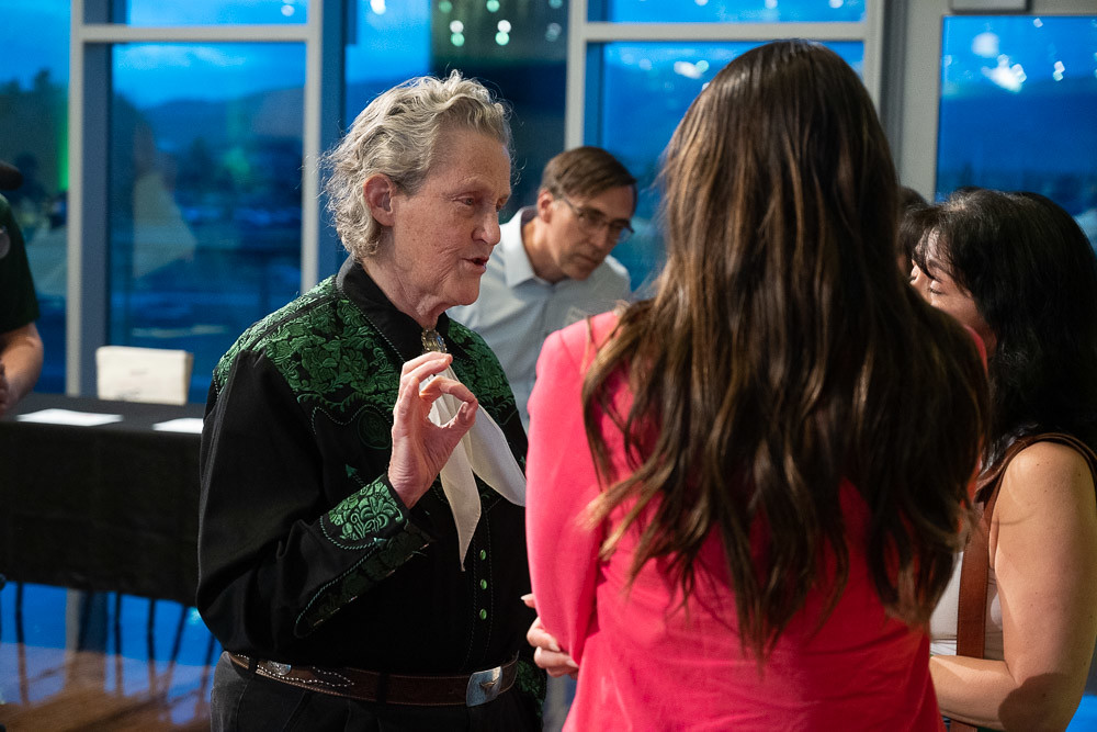 Temple Grandin talks to students after the showcase