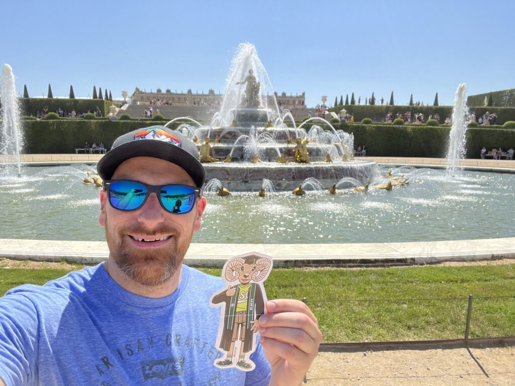 Tim Fuller holds "Flat Cam" at the Palace of Versailles in France.