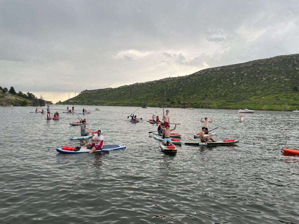 Students at the Global Business Academy paddleboard at Horsetooth Reservoir.